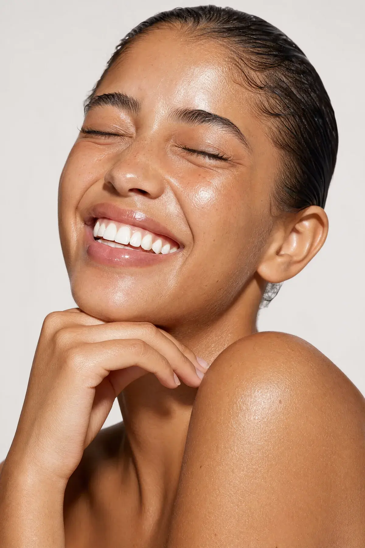 Editorial close-up of radiant, healthy, glowing skin